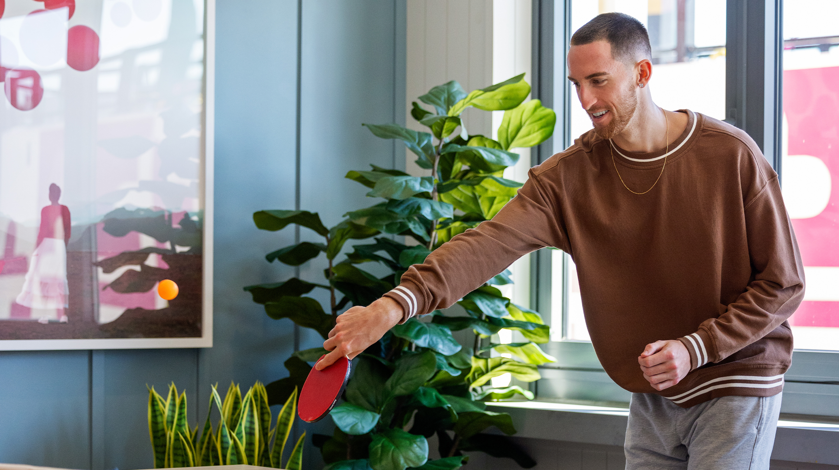 a man playing ping-pong