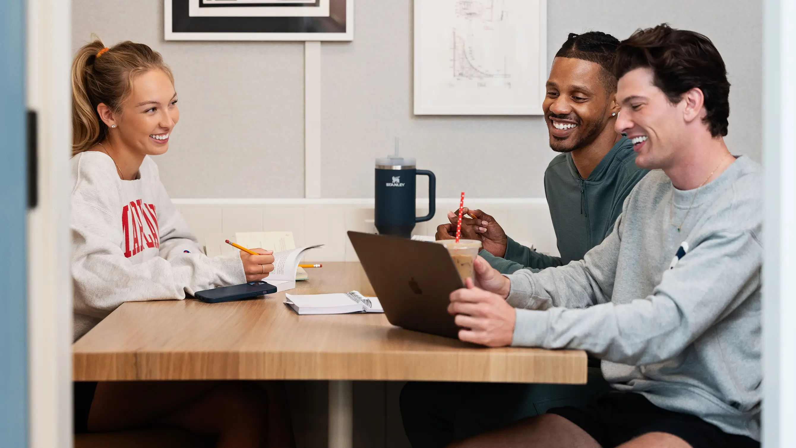 a group of young adults studying