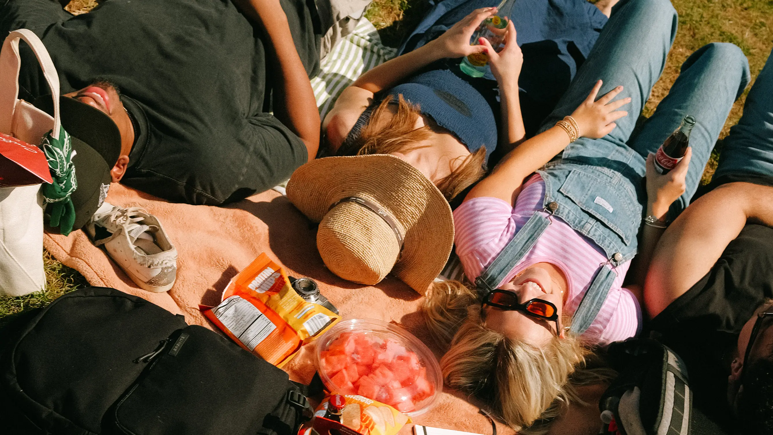 a group of young adults laying down outside